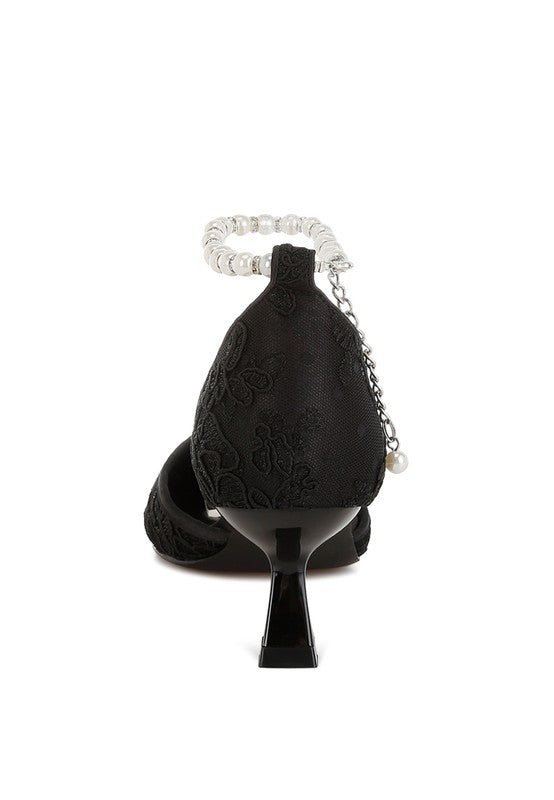 Women's black lace kitten heel sandals with elegant ankle strap.