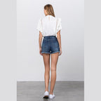 Back view of Insane Gene women's lace lining denim shorts with a frayed hem and casual fit