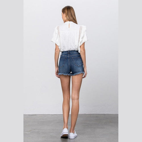 Back view of Insane Gene women's lace lining denim shorts with a frayed hem and casual fit