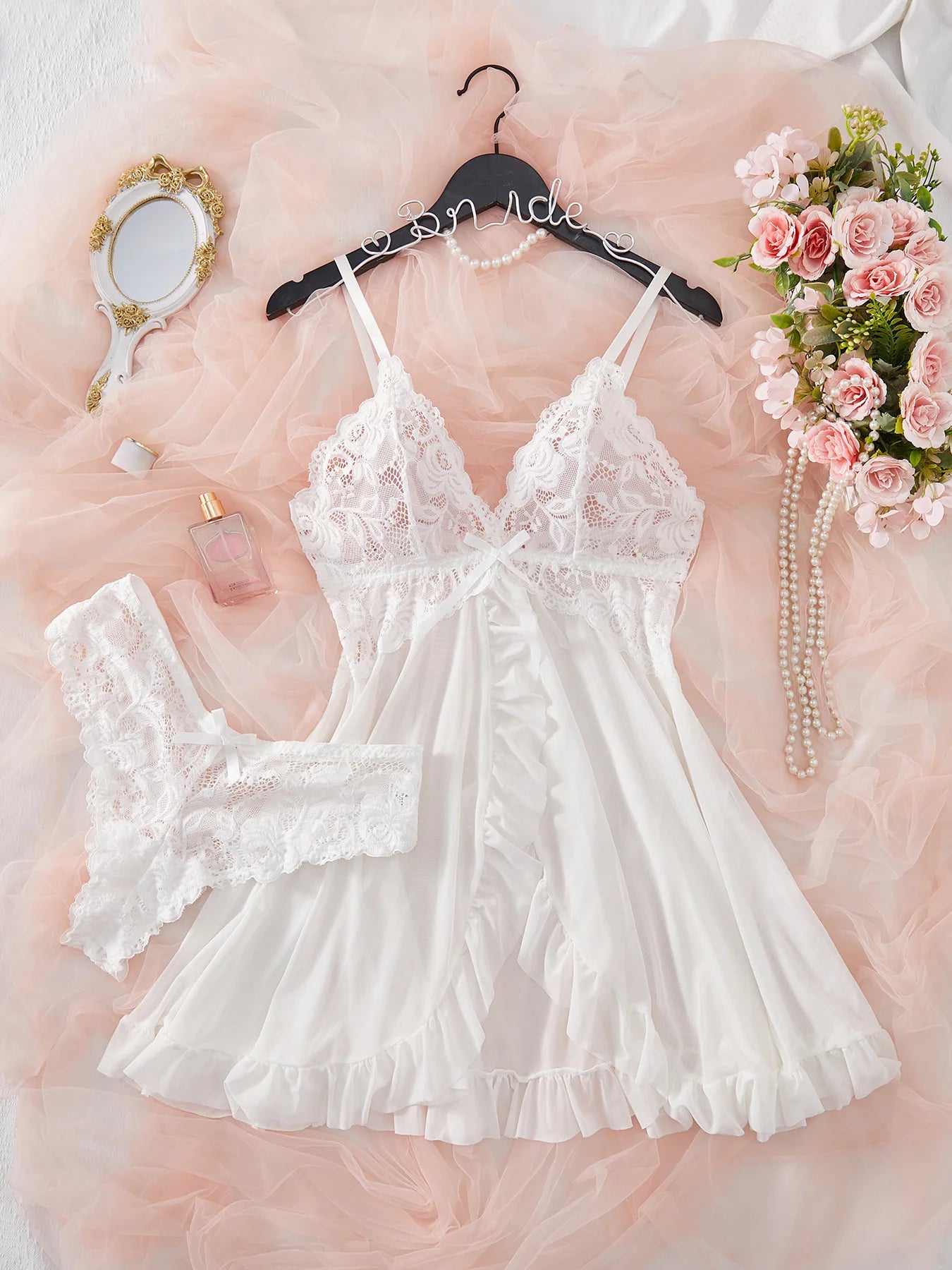 Women's lace sleepwear in white with ruffled hem, perfect for bedtime
