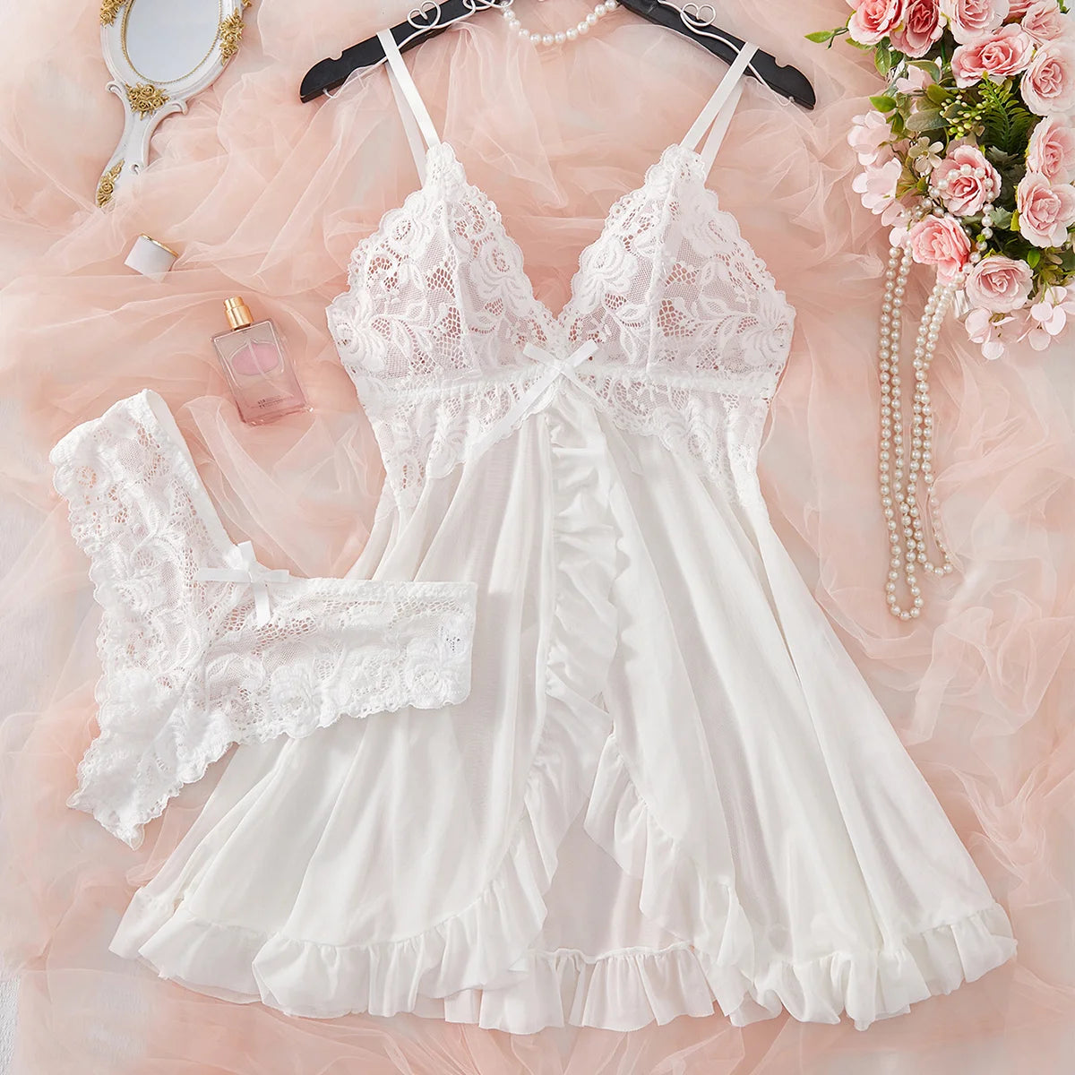 Women's white lace sleepwear set with ruffles and delicate design