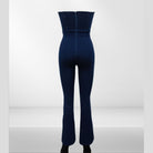 Back view of VacationGrabs lace up denim jumpsuit with a fitted design and flared legs
