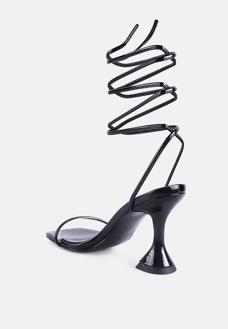 Stylish lace up spool heel sandals in black with a trendy design and elegant silhouette