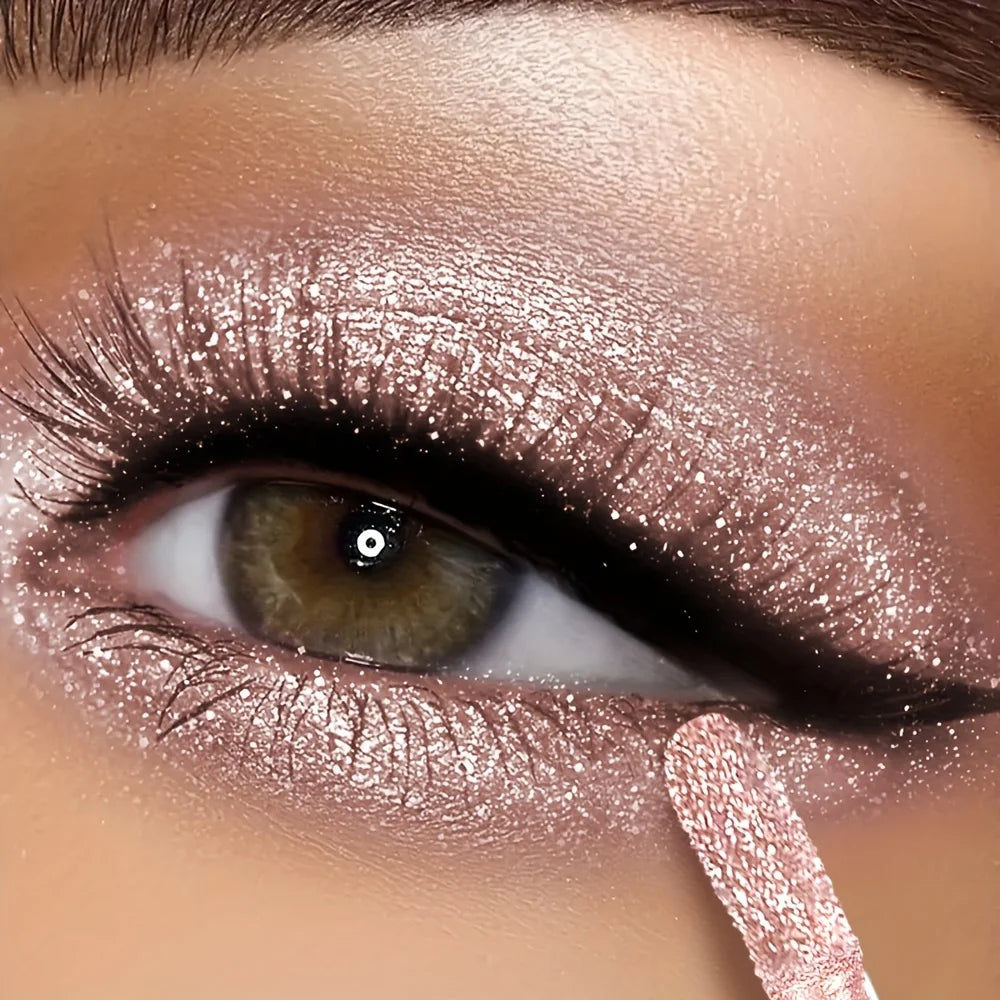 Women's shimmering liquid eyeshadow in rose gold for vibrant eye looks