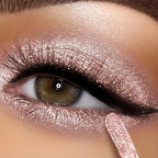 Women's shimmering liquid eyeshadow in rose gold for vibrant eye looks