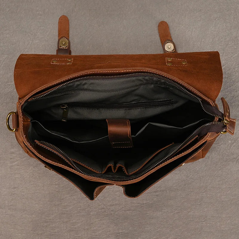 Brown leather laptop and bag with multiple compartments for organized storage