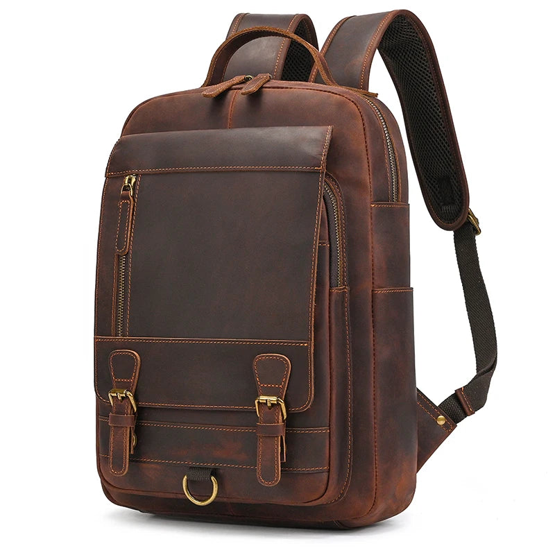 Brown leather laptop backpack, ideal for work and travel.