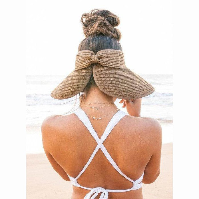 Large brim bow beach hat from Aili's Corner, perfect for sunny days at the beach