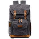 Gray canvas backpack with large capacity for travel and daily use