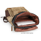 Brown canvas backpack with large capacity, holds 14-inch laptop
