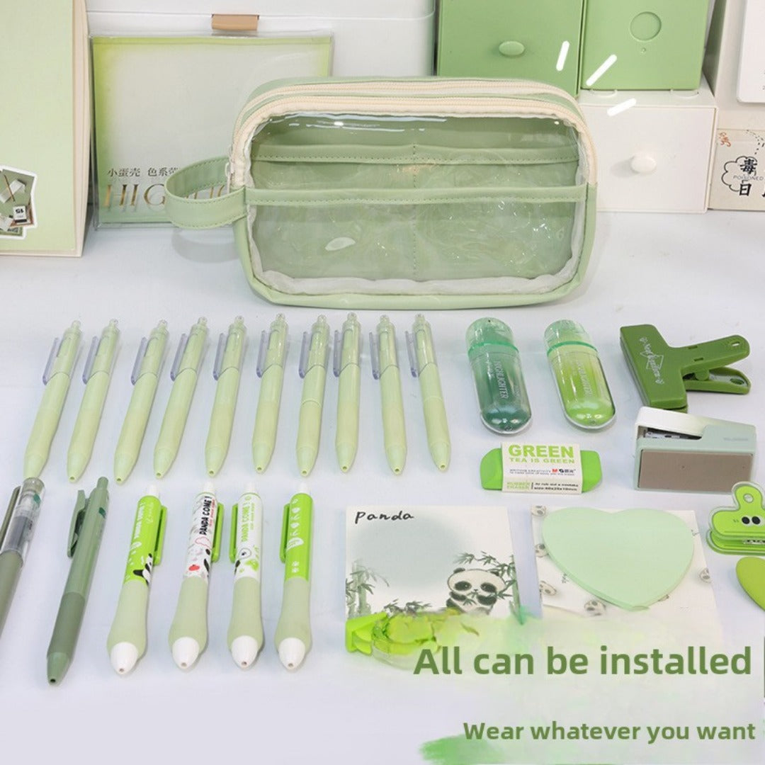 Large capacity transparent pencil case in green with various stationery items arranged neatly inside