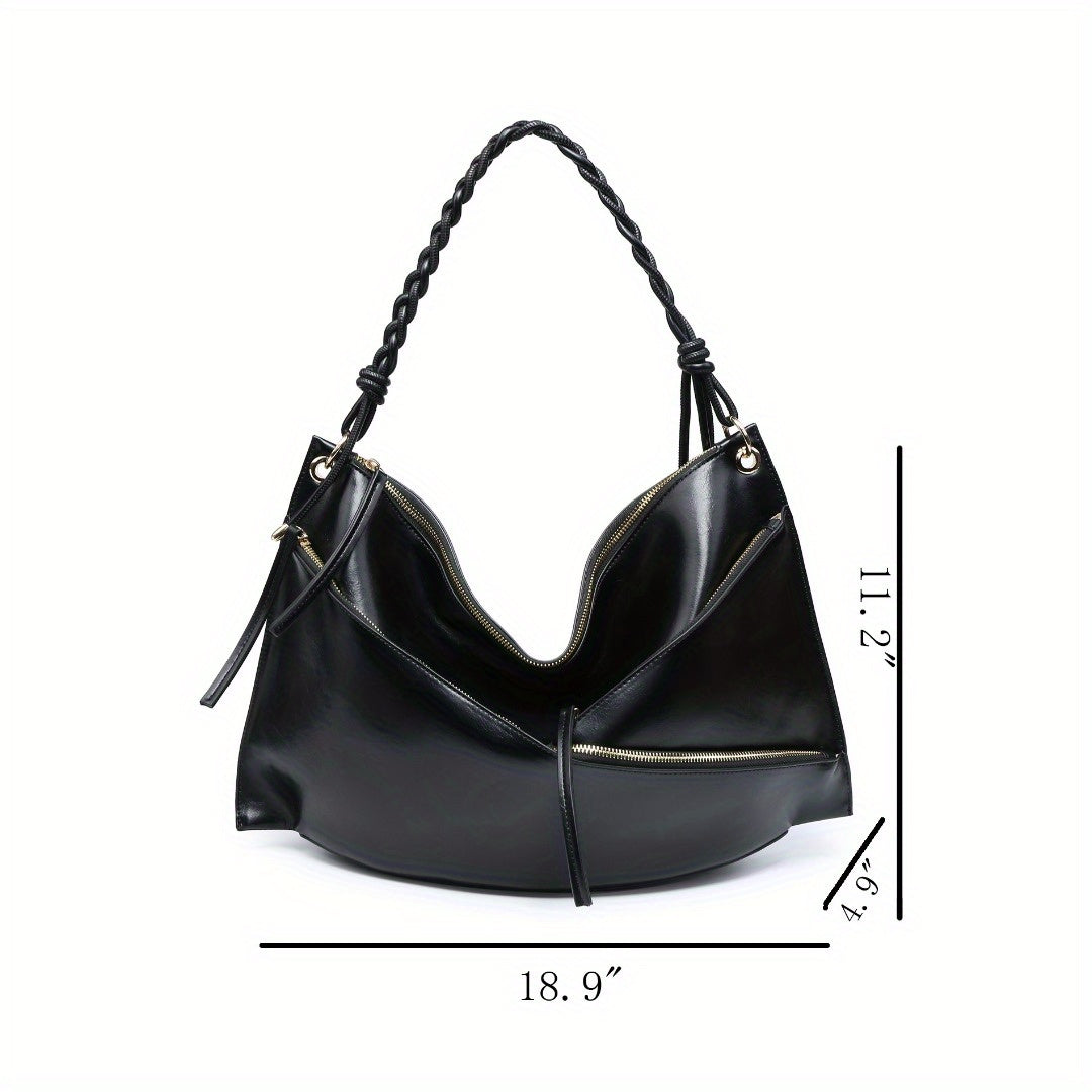 Large handmade shoulder bag in black leather with unique design and braided strap, ideal for everyday use