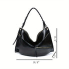 Large handmade shoulder bag in black leather with unique design and braided strap, ideal for everyday use