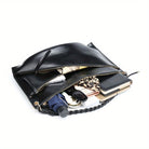 Spacious SHOMICOBOUTIQUE large handmade shoulder bag filled with essentials like notebooks and cosmetics