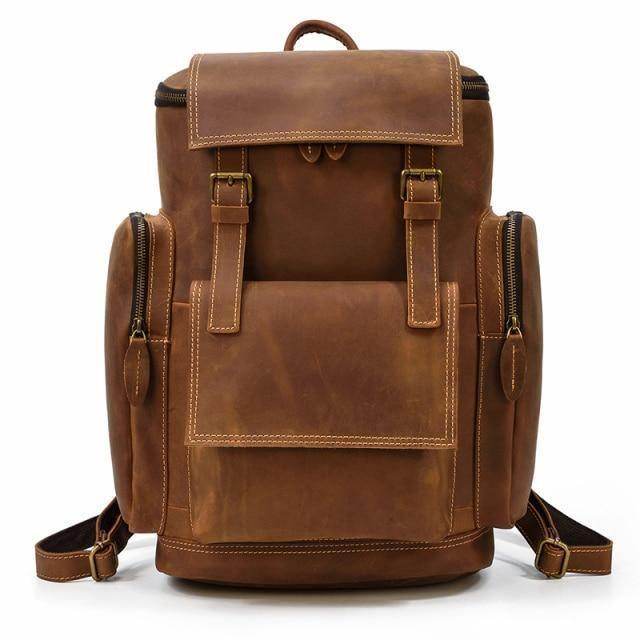 Large leather backpack for travel in rich brown with multiple compartments and adjustable straps