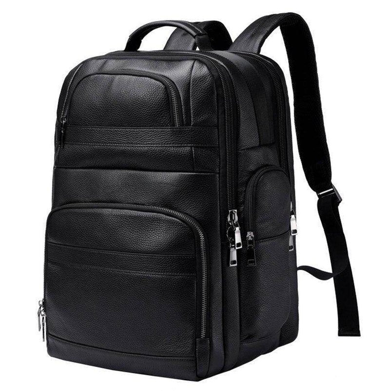 Large leather travel backpack with multiple pockets for organization and comfort on trips