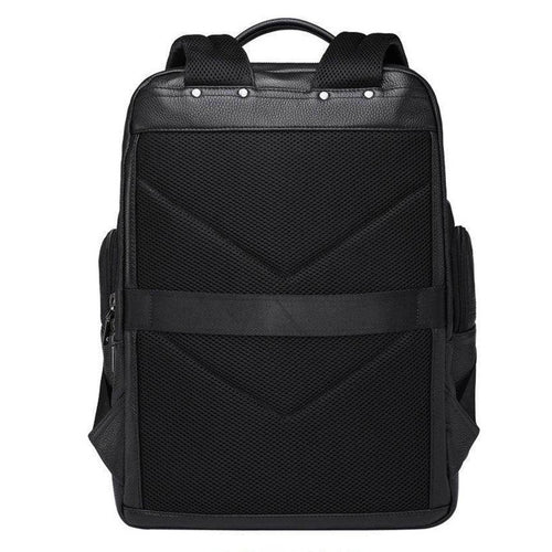 Large leather travel backpack with multiple pockets and padded straps for comfortable carrying