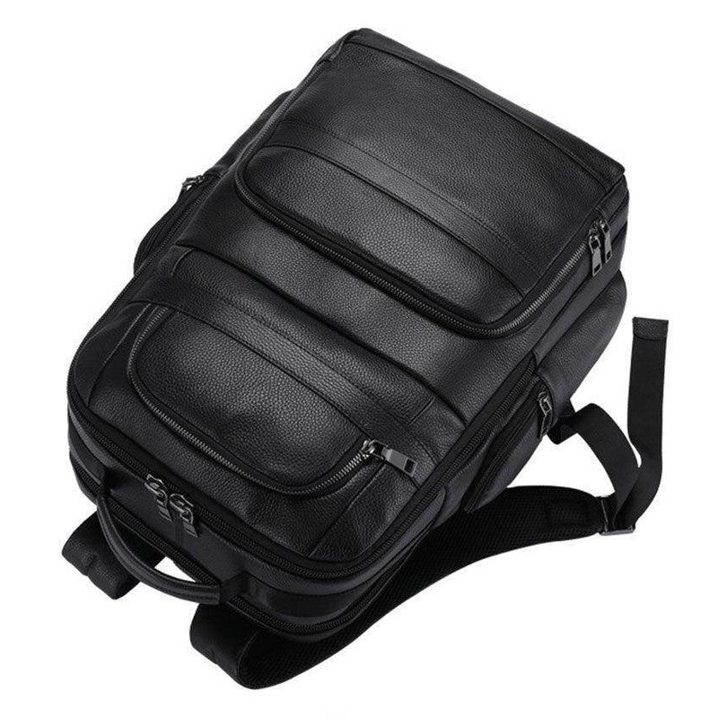 Large leather travel backpack with multiple compartments and padded shoulder straps for comfort