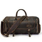 Large leather travel bag with sturdy handles and adjustable shoulder strap for easy carrying
