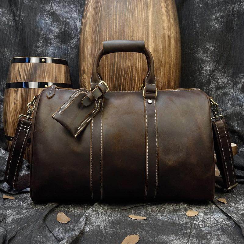Large leather weekend bag from VacationGrabs featuring sturdy handles and a sleek design