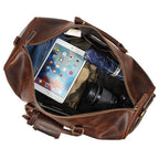 Large leather weekend bag with spacious interior for clothes, tablet, and camera gear