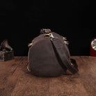 Large travel bag for men made of durable leather, featuring sturdy handles and adjustable shoulder strap