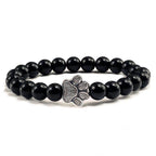Lava stone pet bracelet for men featuring a silver paw print charm on a stylish beaded design