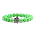 Lava stone pet bracelet with green beads and a stylish paw charm for pet lovers