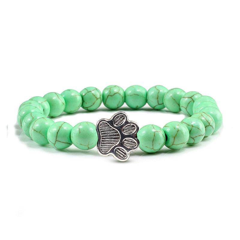 VacationGrabs lava stone pet bracelet featuring green beads with a silver paw print charm