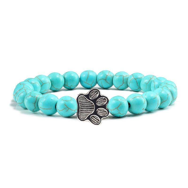 Lava stone pet bracelet featuring turquoise beads and a paw print charm for stylish dog lovers