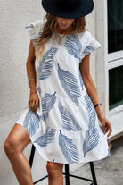 Stylish leaf print ruffle dress from VacationGrabs with tiered design and flutter sleeves