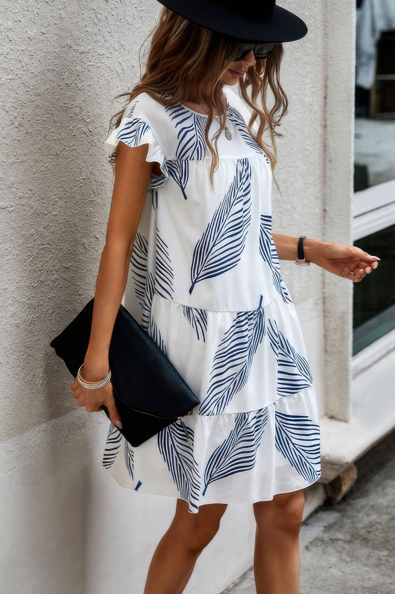 Stylish women's leaf print ruffle dress with tiered design, perfect for summer outings
