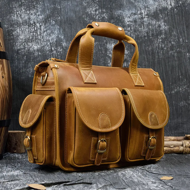 Tan leather bag for laptop with multiple pockets and sturdy handles