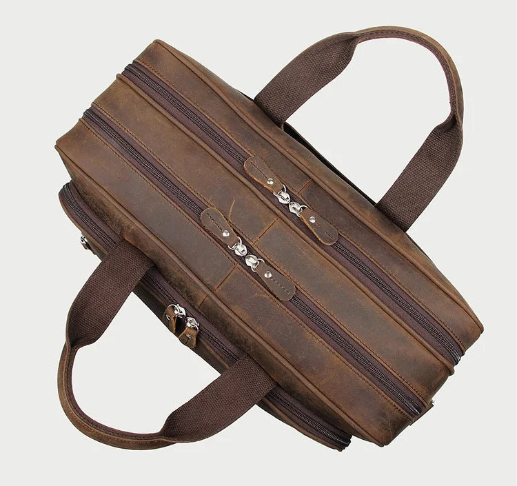 Brown leather briefcase with multiple zippers for professional use