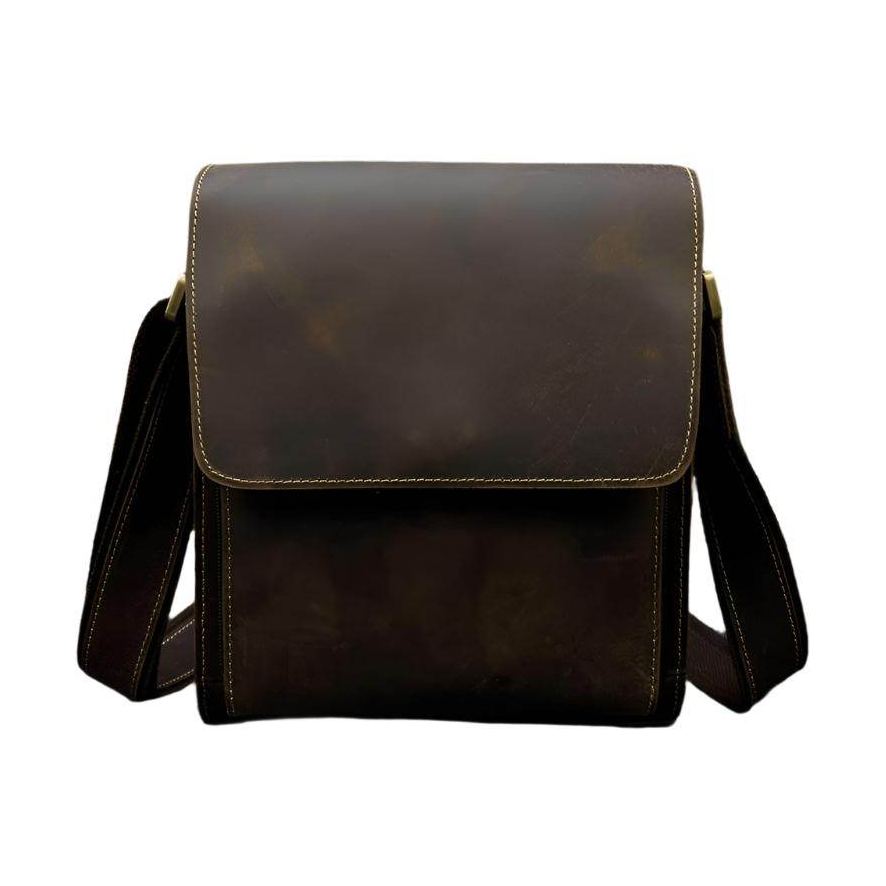 Durable brown leather briefcase for professionals with adjustable shoulder strap and classic design