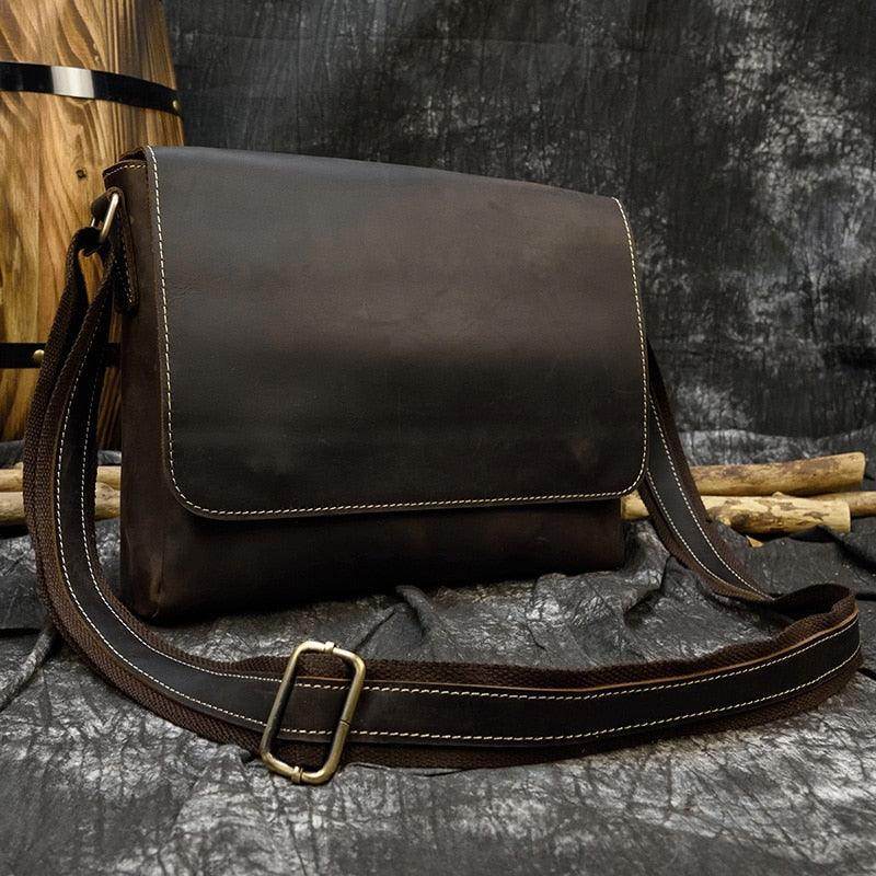 Brown leather briefcase for professionals with adjustable shoulder strap and sleek design