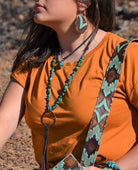 Stylish leather choker with African turquoise paired with matching earrings for a trendy look