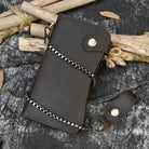 VacationGrabs leather clip wallet for men with chain and snap closure on a textured background
