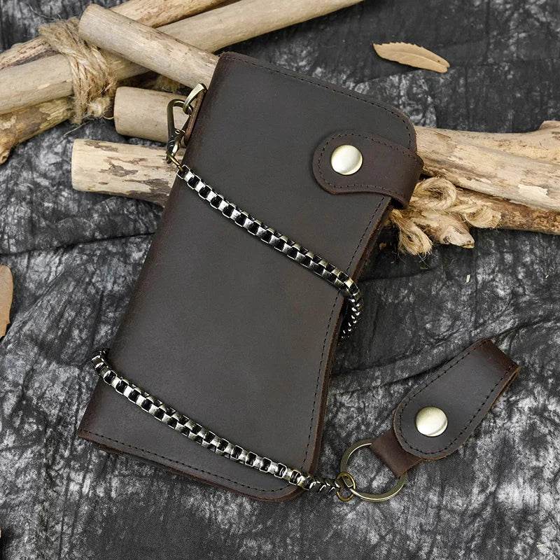 VacationGrabs leather clip wallet for men with chain and snap closure on a textured background