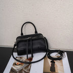 Black leather crossbody mini bag with adjustable strap for daily use