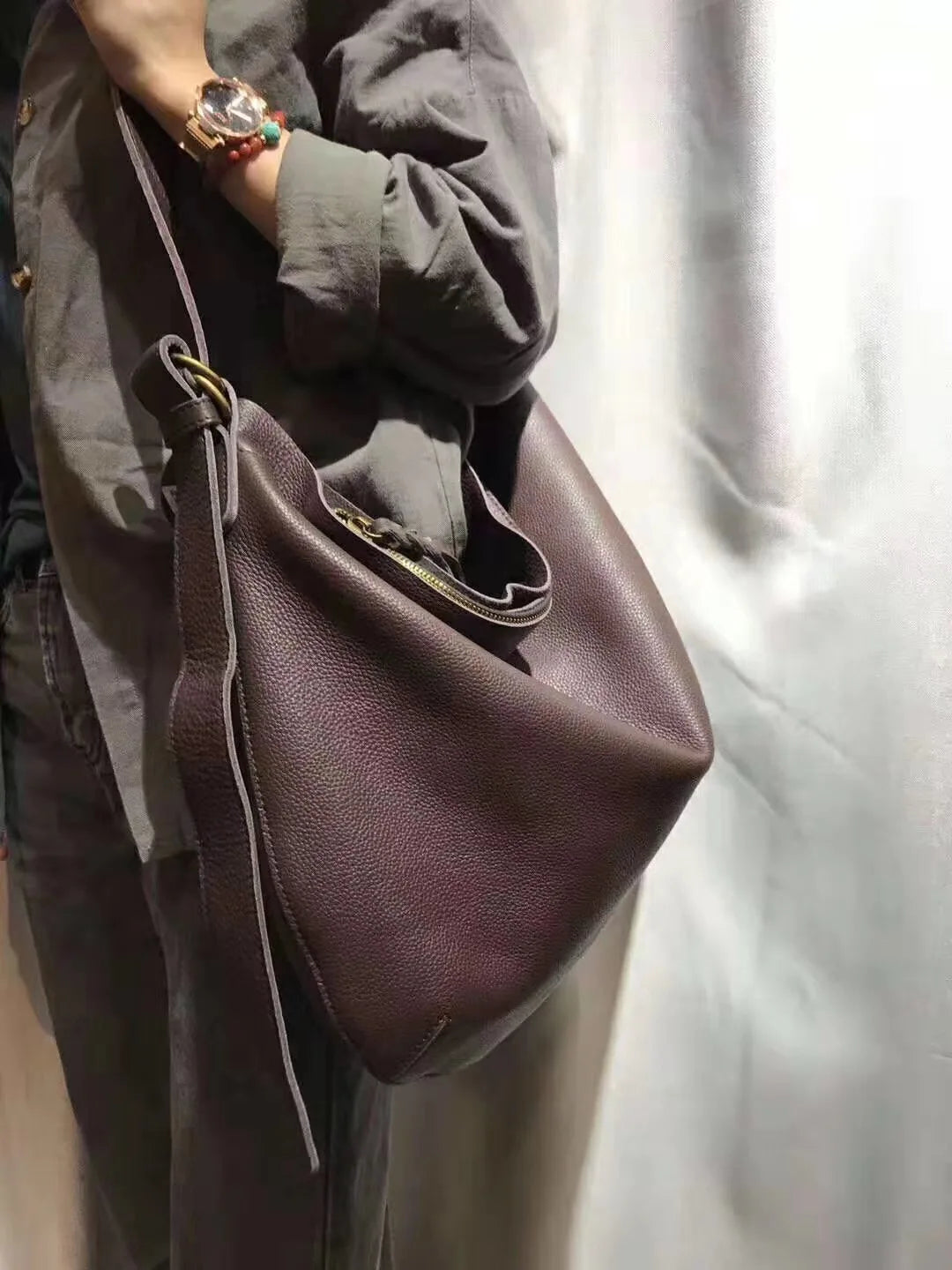Leather crossbody mini bag in deep brown, perfect for casual outings