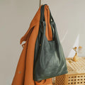 Leather crossbody mini bag in dark green, perfect for stylish outings