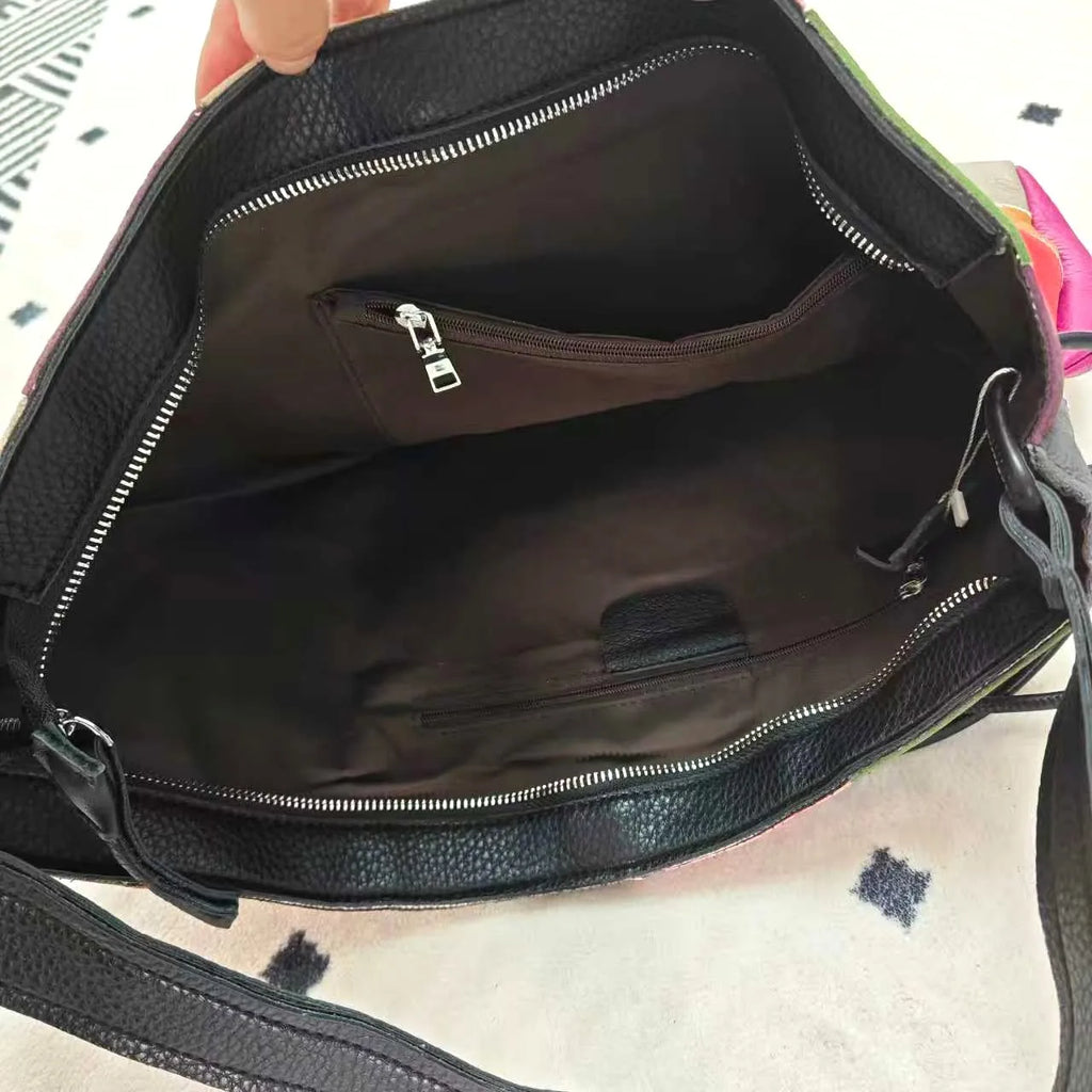 black leather crossbody mini bag with spacious interior pockets