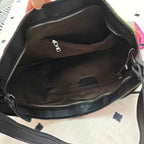 black leather crossbody mini bag with spacious interior pockets