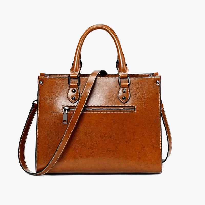 Tan leather crossbody mini bag with adjustable shoulder strap