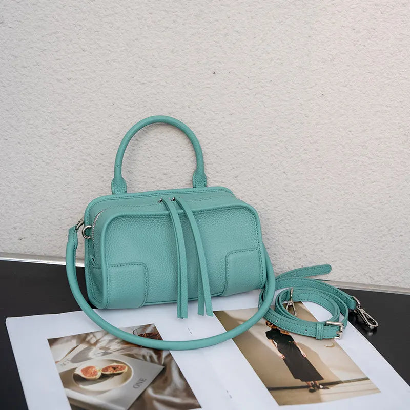 Light blue leather crossbody mini bag with adjustable strap