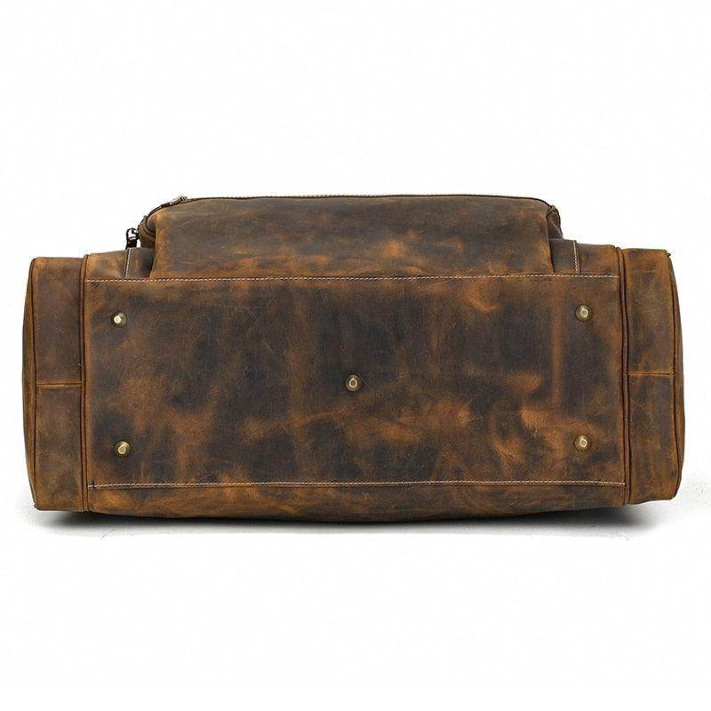 Bottom view of a durable leather luggage tote bag with reinforced base for stability and long-lasting use