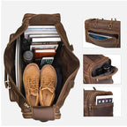 Leather luggage tote bag filled with shoes, books, and electronic devices for travel convenience
