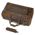 Brown leather luggage tote bag with multiple compartments and sturdy handles for travel convenience
