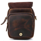 Brown leather messenger bag with a fold-over flap and zippered pockets for practical use